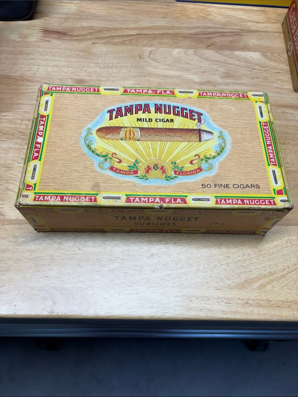 Vintage Tampa Nugget cigar box with old watch parts